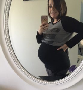 Mirror shot of the contributor at about 6 months pregnant.